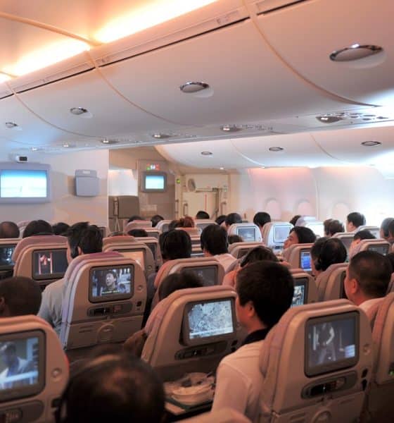 Woman spotted sleeping in plane's overhead bin; netizens reacts