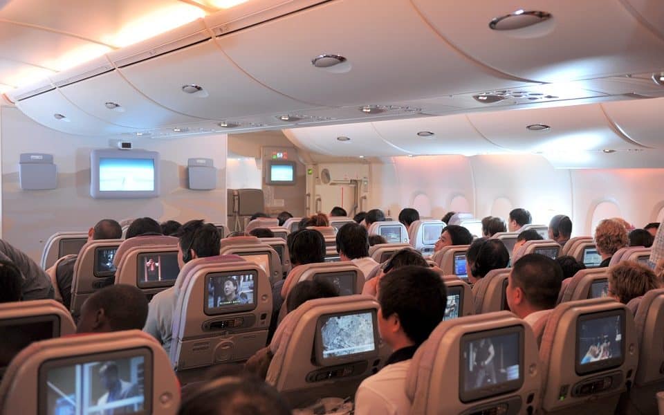 Woman spotted sleeping in plane's overhead bin; netizens reacts