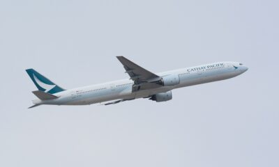 A woman boarded Cathay Pacific flight without a passport & Ticket
