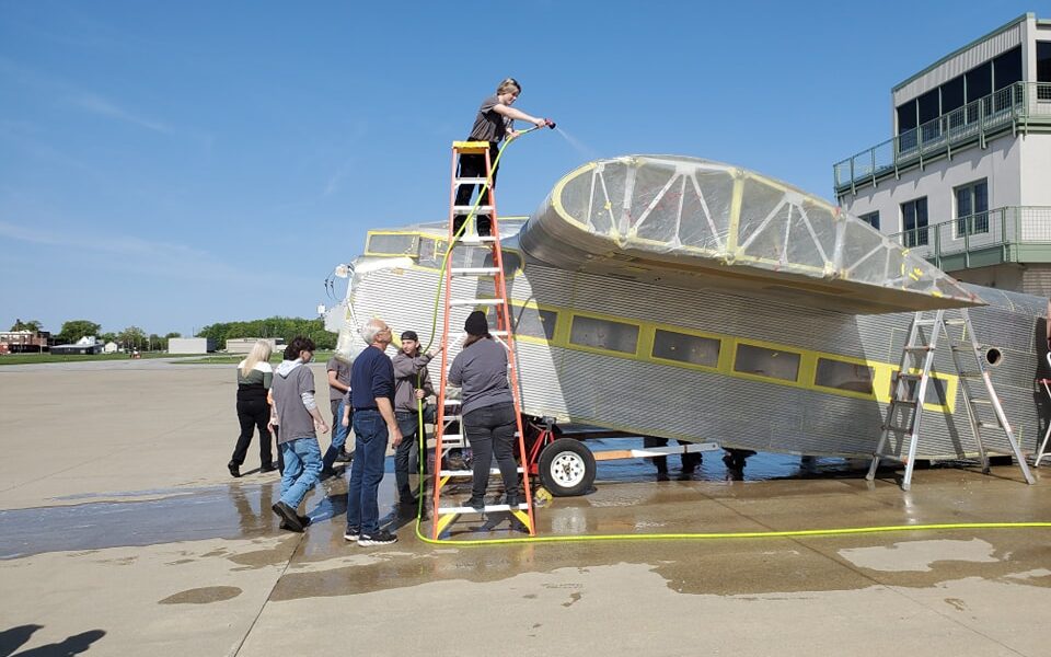 Volunteers restore a 1929 Ford Tri-Motor aircraft to offer trips through living history